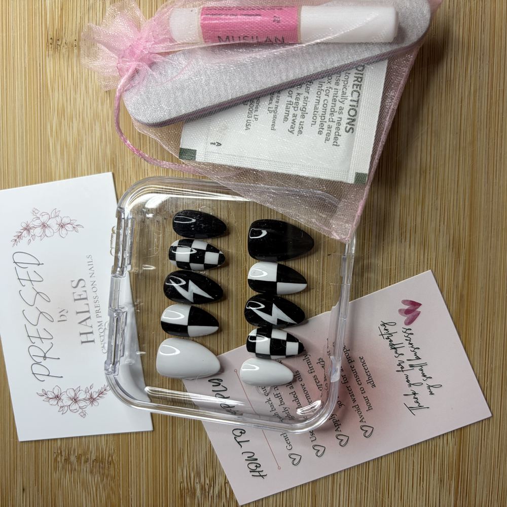 An order as it arrives: the set in its case, the Pressed by Hales card, glue, file and prep wipes in an organza bag